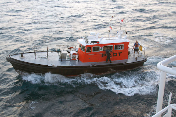 A Bermuda pilot boat comes alongside Lone Ranger to transfer the pilots that are required for navigation during the final approach to Bermuda.