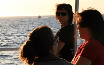 Eve Lundsten, Teresa Cardoza, and Krystle Anderson. On the horizon, the R/V Zephyr approaches for today's