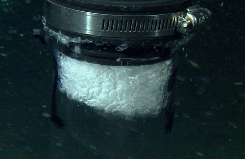 a tube held above a bubble stream
