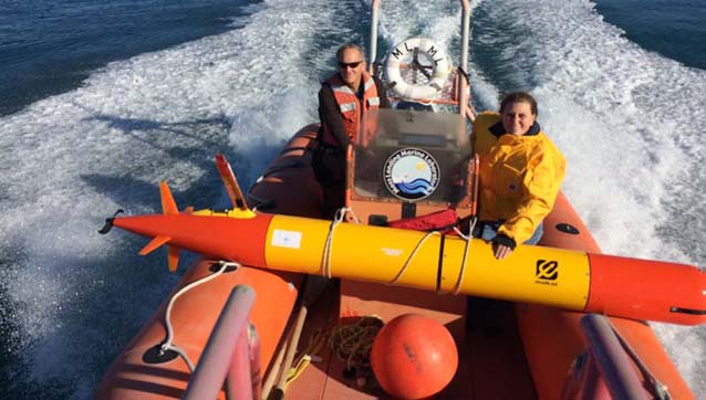 Engineer Brett Hobson and Research Specialist Chris Preston on their way to launch the AUV containing a new genomic sensor.