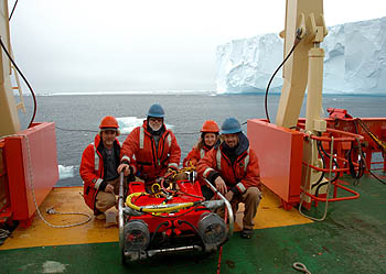 This team of marine biologists from the Monterey Bay Aquarium Research Institute used a small remotely operated vehicle to examine undersea life in the vicinity of two icebergs in the Weddell Sea. From right to left, the members of the ROV team were Kim Reisenbichler, Bruce Robison, Karen Osborn, and Rob Sherlock. Image: (c) 2005 Bob Wilson