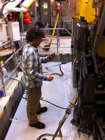 Roberto Gwiazda recovers water from one of the Niskin bottles. He will analyze the water for traces of methane.