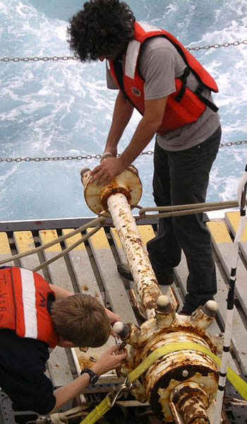 Ryan Portner (top) and Will replace wax-tipped cones on the rock corer on the aft deck. This sampler collects volcanic glass from flows where we will not otherwise have a chance to dive.