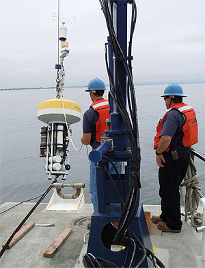 MBARI staff deploy a mooring carrying a DuraFET pH sensor in Monterey Bay. Image: Ken Johnson © 2013 MBARI.