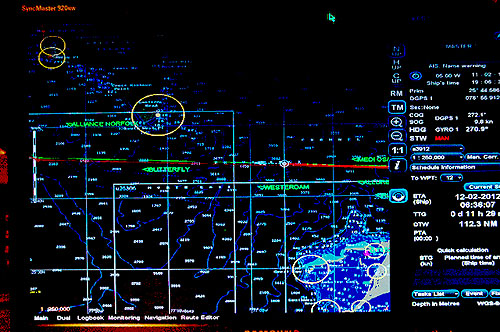 Navigation computers on the bridge show vessel traffic as the Lone Ranger nears the Bahamas.