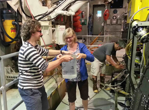 Darrin Schultz, Lynne Christianson, and George Matsumoto. The 12-hour ROV dive ended at 7:00 p.m. and we unloaded all samples from ROV Doc Ricketts and started filming and photographing the day's catch. Most bioluminescence research takes place at night, when it is easiest to achieve dark conditions for photographing the animals.