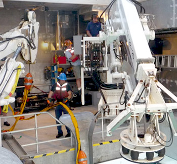 As ROV Doc Ricketts is brought on board at the end of the dive, most of the crew are on deck as part of the recovery. Chief Engineer Matt Noyes (left) pulls the tether aboard, ROV pilot Randy Prickett (right) trains the new Chief Mate Erik Larson (middle) on crane operations.