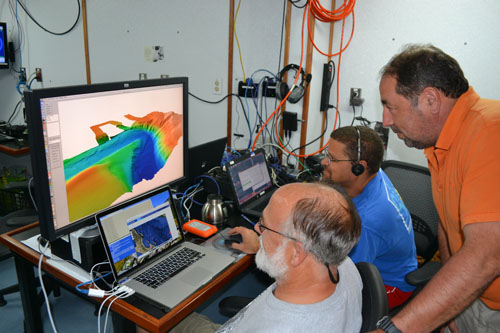 David Caress, Hans Thomas, and Alejandro Hinojosa of CICESE explore the bathymetry of a submarine canyon collected before the AUV was snagged.