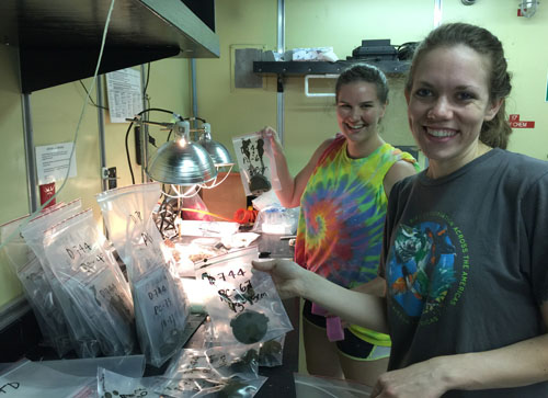 Chrissy Maschmeyer and Abbie Johnson holding baggies with two-centimeter slices of sediment extruded from push cores taken yesterday. We will sieve the bottommost interval of each core and pick out the tiny foraminifera shells for radiocarbon dating.