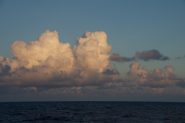 Clouds on the horizon glow during sunset. The Lone Ranger will reach the location of the deep-sea observatory in the early hours tomorrow.