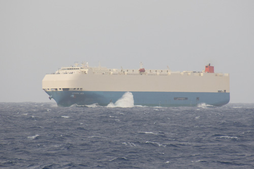Waves crashing up against the hull of this 210-meter-long car carrier show the rough sea conditions. Photo: Debbie Nail Meyer