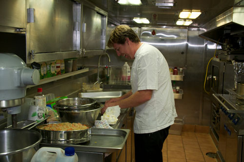 Head Chef Andrew Croft-Brown prepares spring rolls in the ship's galley.
