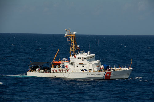 A U.S. Coast Guard cutter responds to an emergency beacon signal.