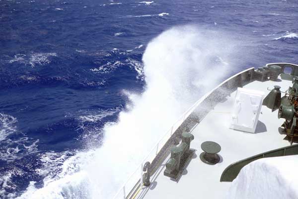 Waves crash over the bow of Lone Ranger as rough weather conditions continue. Periods of sunlight between squalls gave us opportunities to observe the winds and waves from the flying deck, nearly 10 meters above the waterline.