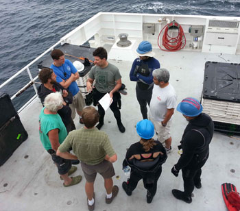 The blue water divers assemble for a safety meeting at the beginning of the cruise to go over the proper standard operating procedures for the dive. Safety is critically important when you are nearly 120 kilometers from land.