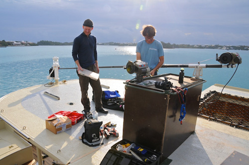 Joe Brock and Don Montague prepare a working area above the aft salon deck for kite operations. Photo: Debbie Nail Meyer