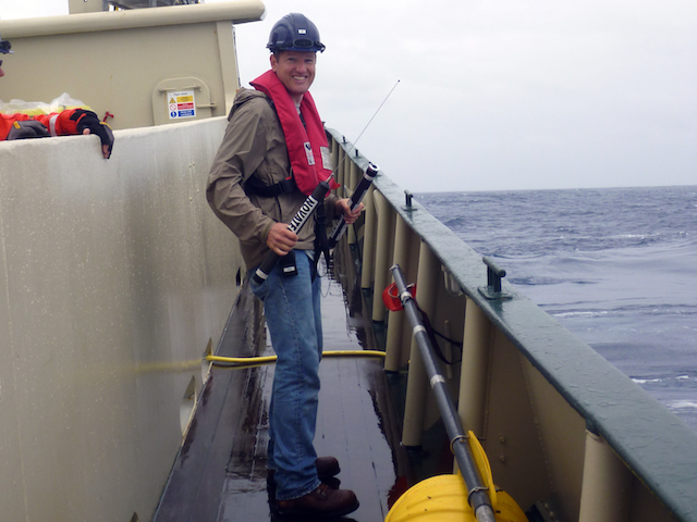 Jeff Drazen prepares the radio transmitter and beacon for the spar bouy that connects to the baited camera system.