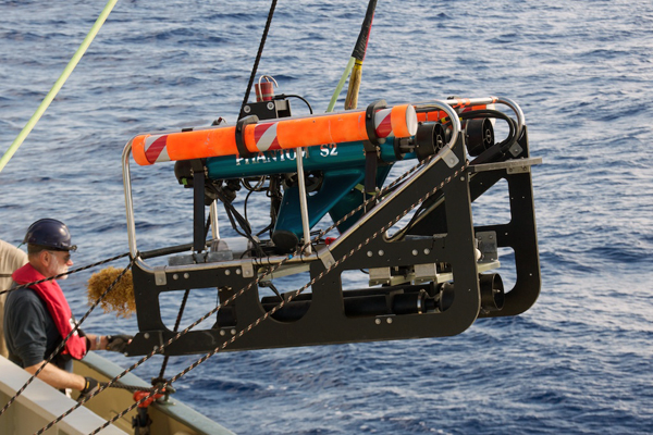 Ken Smith handles the tether line to ROV Phantom during launch into the Sargasso Sea.