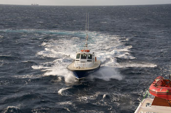 The pilot boat approaches the Lone Ranger. Photo: Debbie Nail Meyer