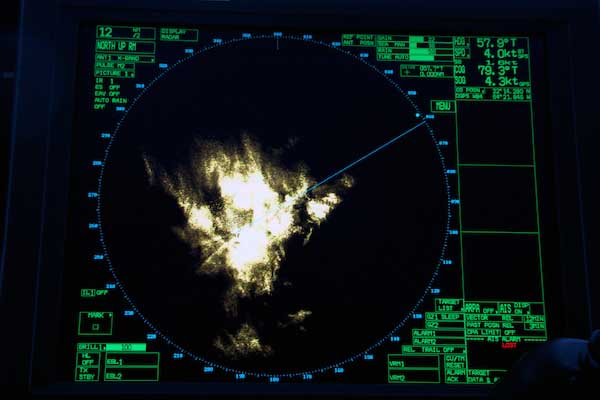Radar on the ship’s bridge shows the ship passing through a thundershower.