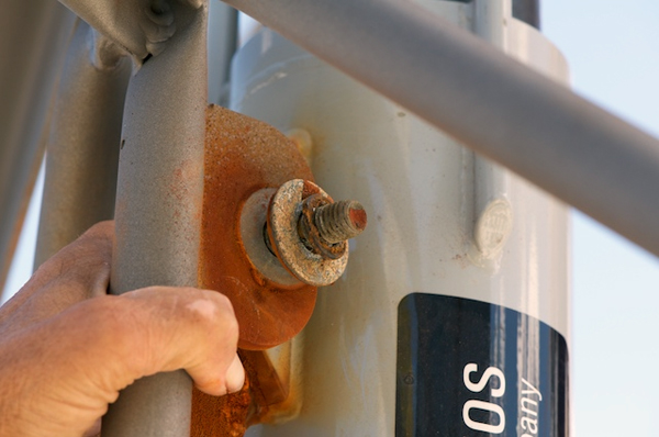 Seawater’s corrosive forces are evident in this extremely rusted steel bolt. The tripod is constructed of titanium that is highly resistant to corrosion, but junctions with other metals, such as this bolt, require consideration of the corrosive potential between the metals. The rusted steel bolt was replaced with a stainless steel one and insulated at the metal contact with plastic tubing.