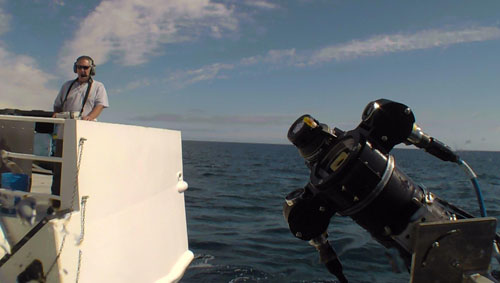 Dale Graves launches the MiniROV off the back deck of the R/V Western Flyer. The DeepPIV is mounted to the MiniROV allowing MBARI researchers to target shallow water organisms (upper 200 meters of the water column). 