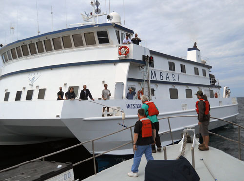 Sharing is caring; the crew of the Western Flyer handed off a spare strobe to the Zephyr's crew when the two ships met in the Gulf of California.