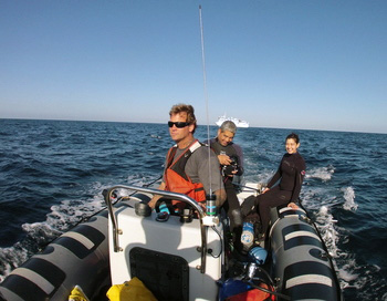 Stephanie Bush and George Matsumoto head out for a blue-water diving adventure. The boat is driven by Craig Heihn.