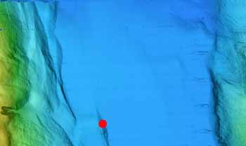This map was created from the AUV multibeam mapping data we received from the R/V Zephyr, also currently working in the gulf. The first dive is located at the southern-most site for this leg in the Farallon Basin about 100 kilometers (62 miles) north of La Paz. The dive target (indicated by the red dot) is a small ridge formed on one of the faults that make up the transform fault between the North American Pacific Plates.