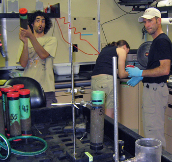 Ryan Portner, Julie Martin, and Ronald Spelz joyfully processing sediment push cores collected with the ROV.