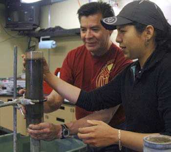 Professor Martín Hernández Ayón and his student Gaby Cervantes process a sample of sediments collected from the deep seafloor. They will analyze the samples to determine what heavy metals are present in the seafloor.