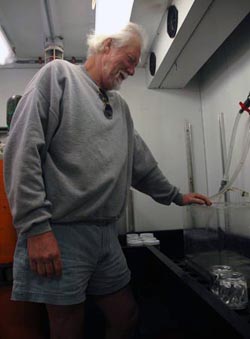 Patrick Whaling prepares the seawater lab so we can keep animals from the benthic respirometer system for study.