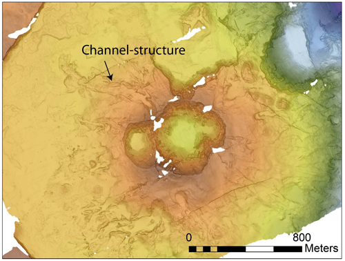 Figure 2: Pair of small craters with channel structures radiating outward. The dive began on the floor of the smaller of the two craters that you can see here, and the channel-structure we flew along is indicated by the arrow.