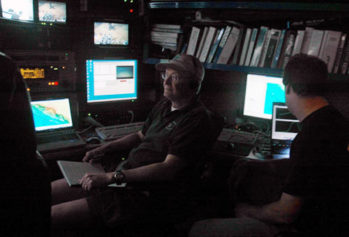 During ROV dives, Ed Peltzer, left, manages the video annotation system and dive-related data and maps, and meticulously logs every detail of the dive. Peter Walz, right, manages the laser Raman spectroscopy system.