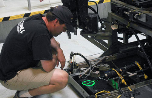 Research technician Peter Walz inspects the coil of tubing on the liquid-core waveguide prior to sending it down to 2,000 meters (6,500 feet) for testing. It looked perfect on deck, but when it got to depth, it wasn’t quite as good as hoped for.