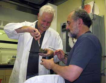 Longtime collaborators Charlie Paull and Juan Carlos Herguera process a push core for foraminiferans.