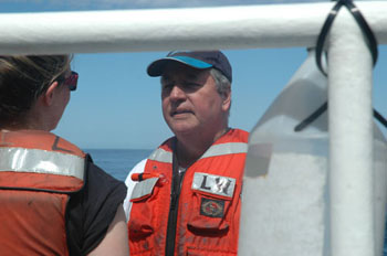 Chief scientist Francisco Chavez converses with Marguerite Blum on the well deck during a CTD cast.