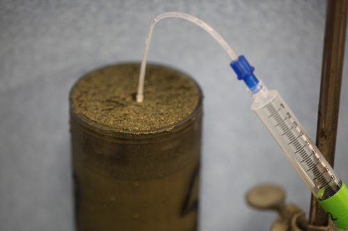 Extracting pore water from a push core to measure methane and sulfate. Here we are using the