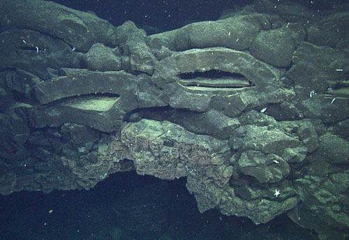 thick rim remaining of collapsed roof of a drained lobate flow