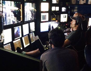 Pilots Bryan Schaefer, in the foreground, and Mark Talkovic work together to maneuver the ROV Doc Ricketts and its robotic arms.