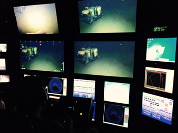 Electrical Engineer Paul McGill controls the science camera as ROV Doc Ricketts flies near the Benthic Rover. The research team was happy to see that the Rover was properly functioning.
