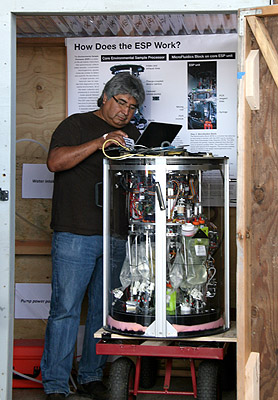 MBARI Senior Research Technician Roman Marin III programs the Environmental Sample Processor at Taylor Shellfish Farms in Samish Bay, Washington. Image: National Oceanic and Atmospheric Administration (NOAA) Northwest Fisheries Science Center.