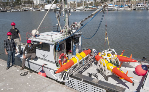Ben Yair Raanan, Brian Kieft, and Brett Hobson prior to the deployment of three long-range autonomous underwater vehicles from the R/V Paragon in Monterey Bay. Photo by Todd Walsh.