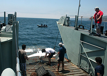 Engineers from the University of Porto prepare to launch an unmanned aerial vehicle (UAV) from the ramp of a landing craft supplied by the Portuguese Navy for the REP-13 experiment. Image: Marina Oliveira.