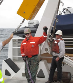Chief Scientist Ken Smith directing the recovery operations. The syntactic foam floats used at Station M are far too heavy to lift onto the ship by hand, and must be raised by a winch.
