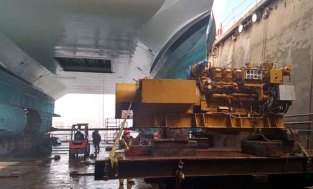 One of the Western Flyer's engines ready to be lifted by crane. 