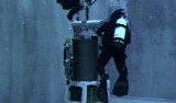 Two divers check out the second-generation ESP in MBARI's test tank before an early 2006 deployment. The ESP works well identifying proteins and other gene products in surface waters. The design team is now working to make the system function at 90 times surface pressure, and to allow the ESP to sequence DNA. Image: Todd Walsh, MBARI.