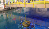 Researchers work on an early, cylindrical version of the FOCE experiment. Image: Kim Fulton-Bennett, ©2005 MBARI.