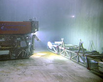 This photo shows the flume for the FOCE experiment underwater in the MBARI test tank, along with the remotely operated vehicle Ventana. Seawater enriched with carbon dioxide will be sent down this flume, mixing as it goes. In the center of the flume is an open area where animals on the seafloor would be exposed to the slightly acidified seawater. Image: Todd Walsh, ©2008 MBARI.