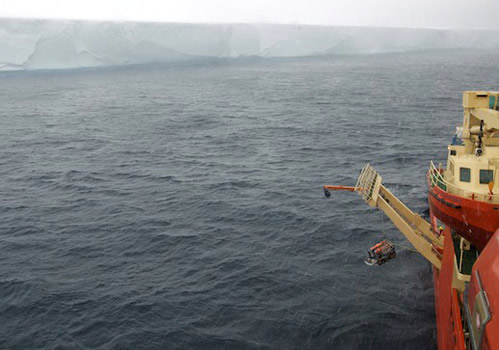 ROV IceCUBE is lowered into the sea on a wet, blustery day. Photo by Vivian Peng.